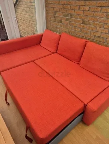 Orange L-Shaped Sofa Bed with Pull Out Section