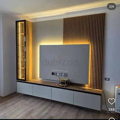 Modern wall-mounted entertainment unit with LED backlight and display cabinet