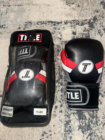 Title: Pair of Title boxing gloves with carry case - good condition