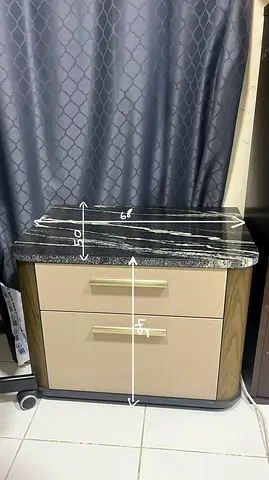 Pair of bedside nightstands with marble tops and drawers