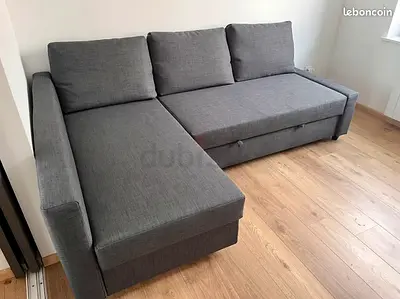 Grey L-shaped sofa bed with storage - good condition