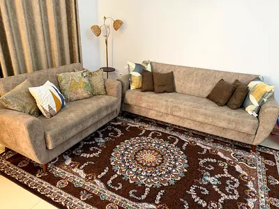 Pair of neutral beige storage 5 seater sofa with coffee table