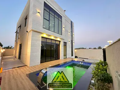 بدون رسوم تسجيل فيلا 4 غرف ماستر مع مسبح بمنطقة الزاهية مقابل مجمع الخدمات والطرق الرئيسيه سهل الخروج الي دبي والشارقه