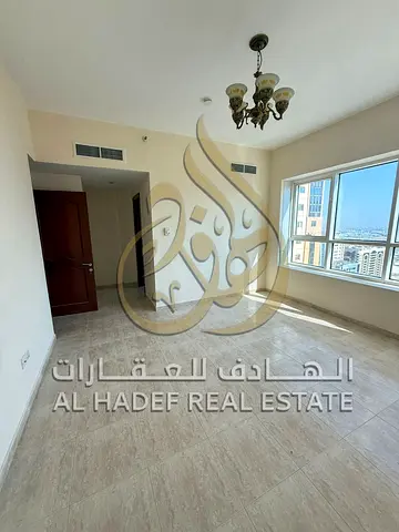شقة غرفتين وصالة منفصلة مع غرفة غسيل للإيجار السنوي في التعاون الشارقة | موزع وتكييف على المالك | جيم ومسبح وباركينج مجاني | دفعات 4 أو 6 شيكات | السع