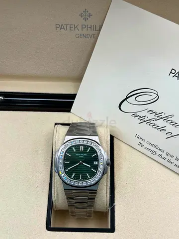 Patek Philippe Nautilus ref. 5711/1300A-001 featuring an olive green sunburst dial and a bezel set w