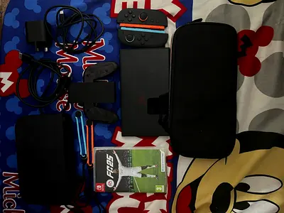 Used Nintendo Switch console with Joy-Con, dock, case and FIFA game no box