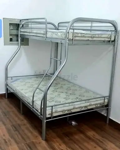 Silver metal bunk bed with twin over full mattresses — good condition