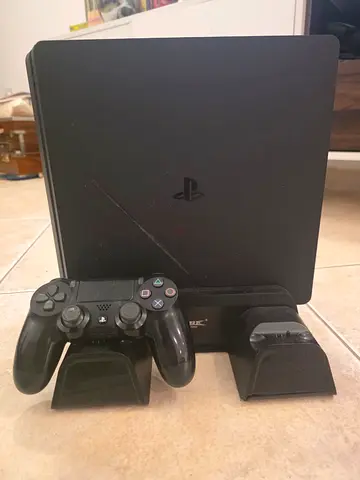 PlayStation 4 Slim international v. with 1 DualShock 4 controller and cooler stand - Used like new