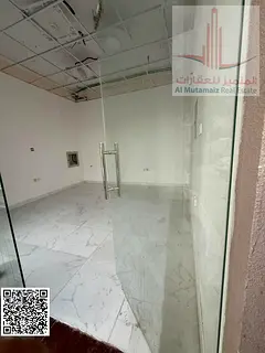 Shop for Rent in Al Rashidiya Ajman at a Competitive Price, Corner Building Facing Two Streets with 