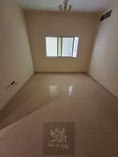 For rent in Al Khan Sharjah two bedroom apartment with living room two bathrooms central AC annual r