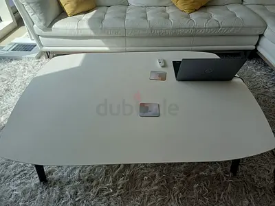 Modern low-profile white coffee table with wooden legs - great condition