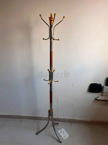 Free-standing metal coat rack with gold accents - good condition