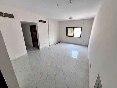 One bedroom and living room, second occupant, in a new building in Al Nuaimiya 2, with a large area, central air conditioning, and maintenance include