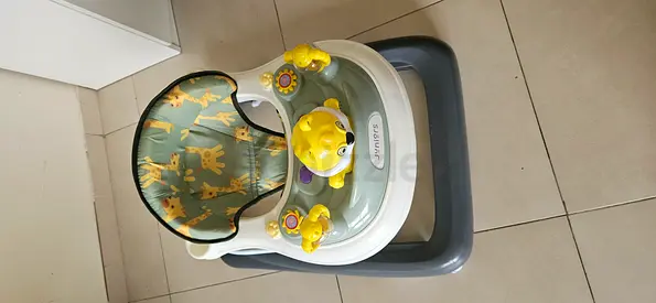 Lightly used baby walker with seat and activity tray