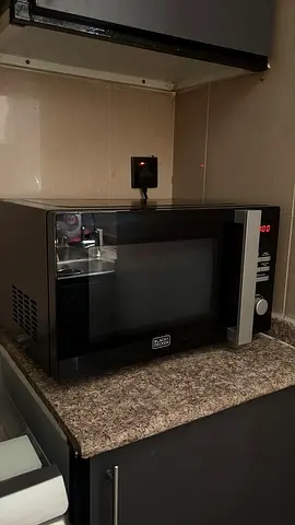 URGENT SALE- Black countertop microwave oven - good working condition- NO DAMAGES