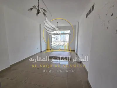 One bedroom hall in Al Majarah Sharjah balcony open view master room built in wardrobes central AC spacious layout flexible payment options