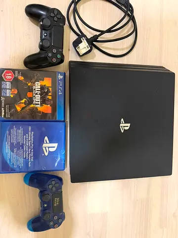 Sony PlayStation 4 Pro with 2 Controllers and 2 Games optional- Good Working Condition