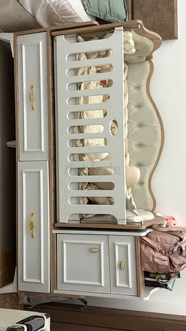 Wooden convertible baby crib with attached dresser - cream/beige