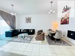Sharjah, Al Mamzar: One-bedroom apartment with a living room, a view, two bathrooms, and a balcony.