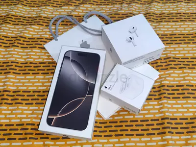 iPhone 16 Pro Max with AirPods Pro 2 and Apple Charger