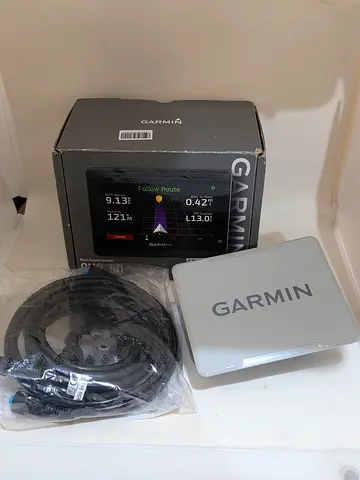 Garmin GPS device with cables and original box - good condition