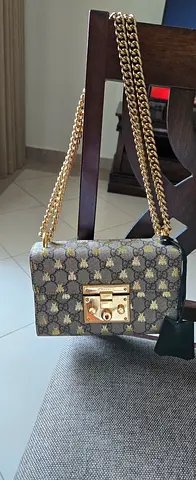 Small designer-style chain Gucci bag in brown monogram print