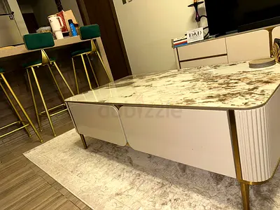 Modern white marble-top coffee table with storage and gold legs. Tv console also included.