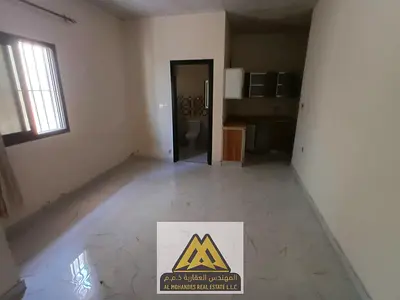 Studio for rent in Al Nuaimiya 2, second tenant, ground floor, semi-separate kitchen, central AC. AED 17K, 4 payments.