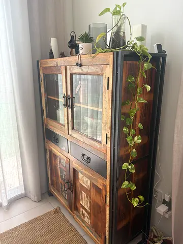 Rustic wooden display cabinet with glass doors — sturdy storage unit