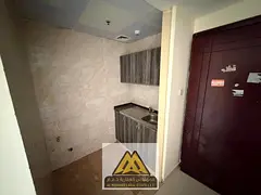 Spacious studio in Al Nuaimiya 3, separate kitchen, central AC, free maintenance, near Sharjah & She