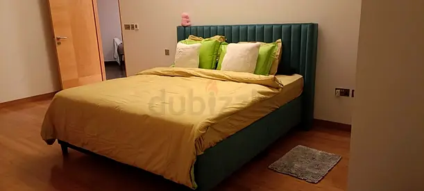 Queen upholstered bed frame with green velvet headboard - excellent condition