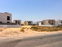 Land for sale in Tilal City with a G+3 building permit; ready for construction and offered at an exc