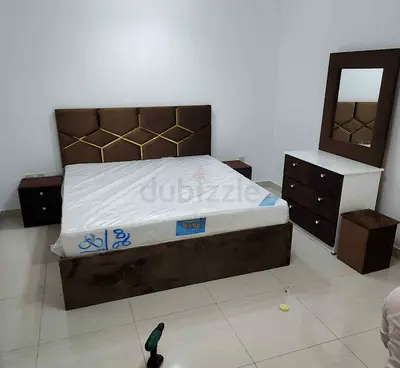 Brown upholstered king bed frame with mattress, dresser and mirror - set