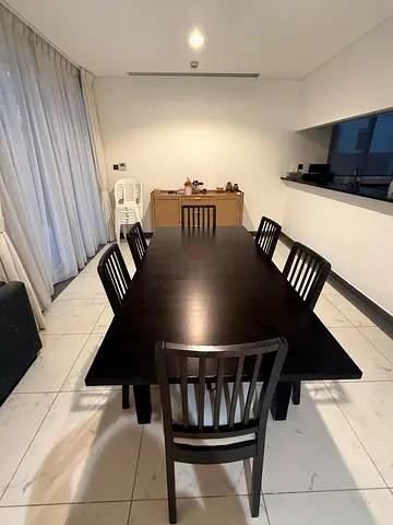 Solid dark wood 6-seater dining table with chairs - good condition