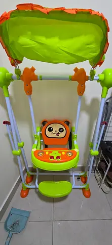 Baby swing with canopy and toy tray - good condition