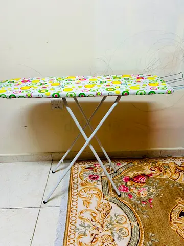 Used ironing board with patterned cover - good condition