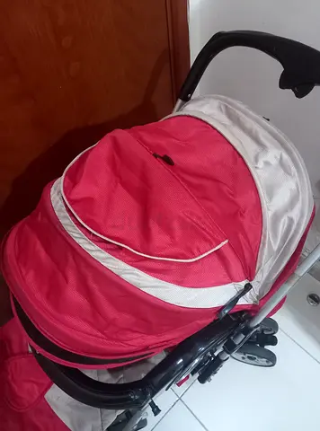 Lightweight red baby stroller in good condition