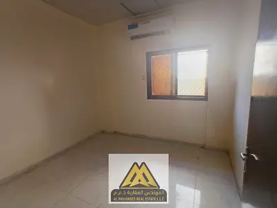 2BR in Al Nuaimiya 2, 1 bath, split AC, maintenance by owner, near services and easy access to Dubai & Sharjah, AED 30,009/year.