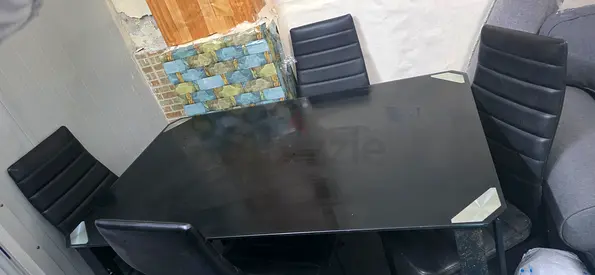 Used black dining table with 4 high-back chairs