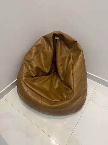 teardrop-shaped brown bean bag chair originally bought from HomeCentre.
Made from high grade leather
