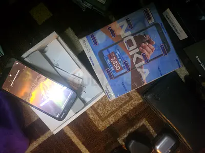 Nokia C1 original box and charger - good working condition ONLY 100AED