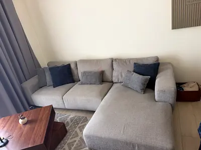 Light grey L-shaped 3-seater sofa with chaise - good condition