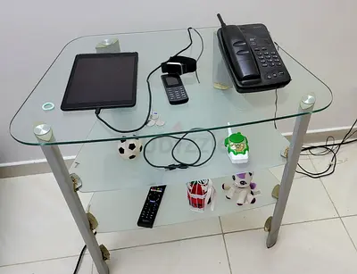 3-tier glass table in with clear top, frosted shelves, and strong silver legs Must Go Today