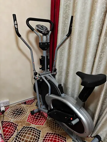 Used upright exercise bike with moving arms - good condition