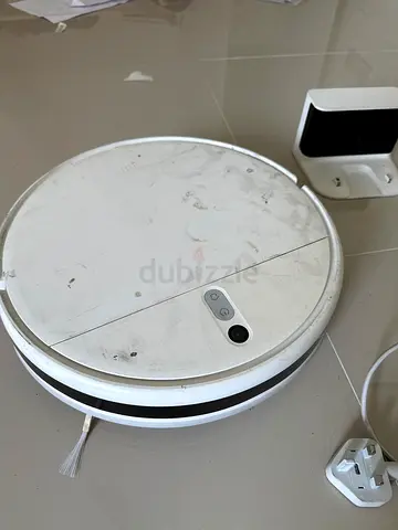 Used white robot vacuum cleaner - functional