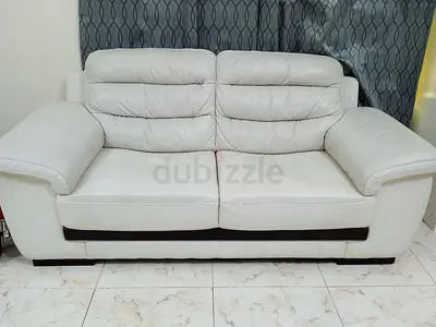 Cream leather 2-seater sofa in good condition