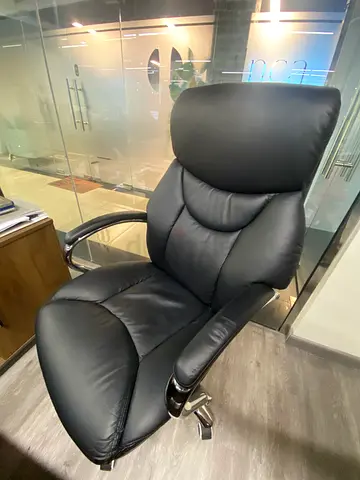 Black leather swivel office chair with headrest - good condition