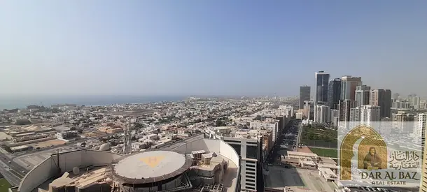 Two-bedroom apartment with a living room for annual rent in Al Khan area. Two bathrooms, free parking. The apartment has an open view overlooking Al K