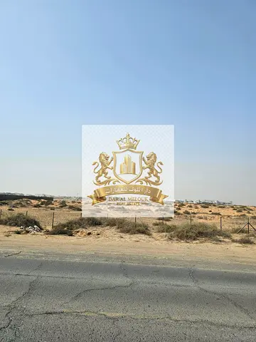 For sale in Sharjah, bordering Ajman: Commercial land plot measuring 2422 sq ft, prime location on