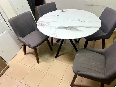 Round Marble-Top Dining Table with 4 Grey Upholstered Chairs
